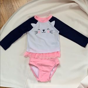 Rash guard top with ruffles and bottoms